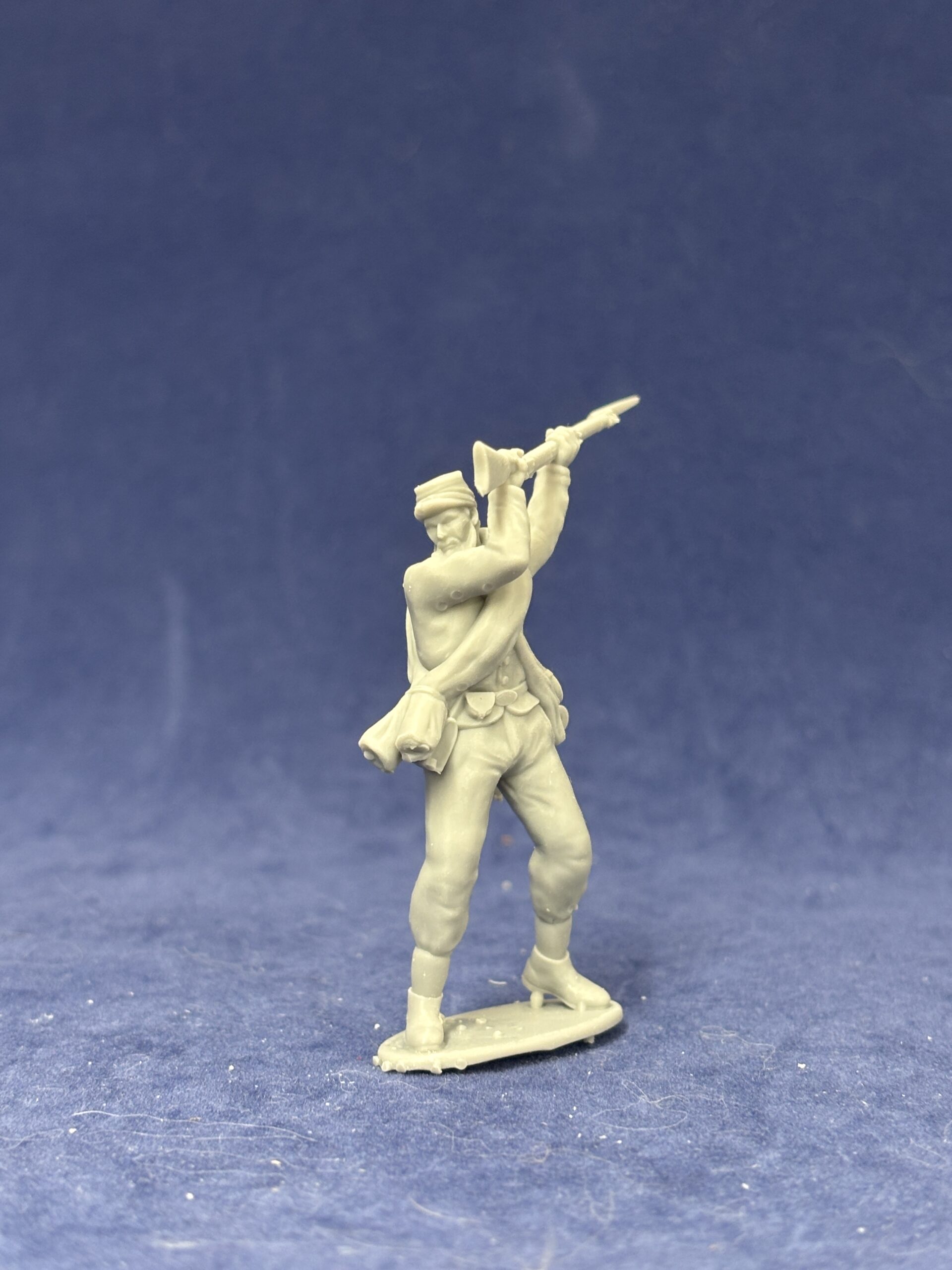 Confederate soldier in kepi attacking with rifle butt