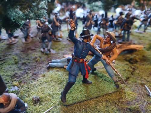 Union officer beating Confederate soldier with revolver photo review