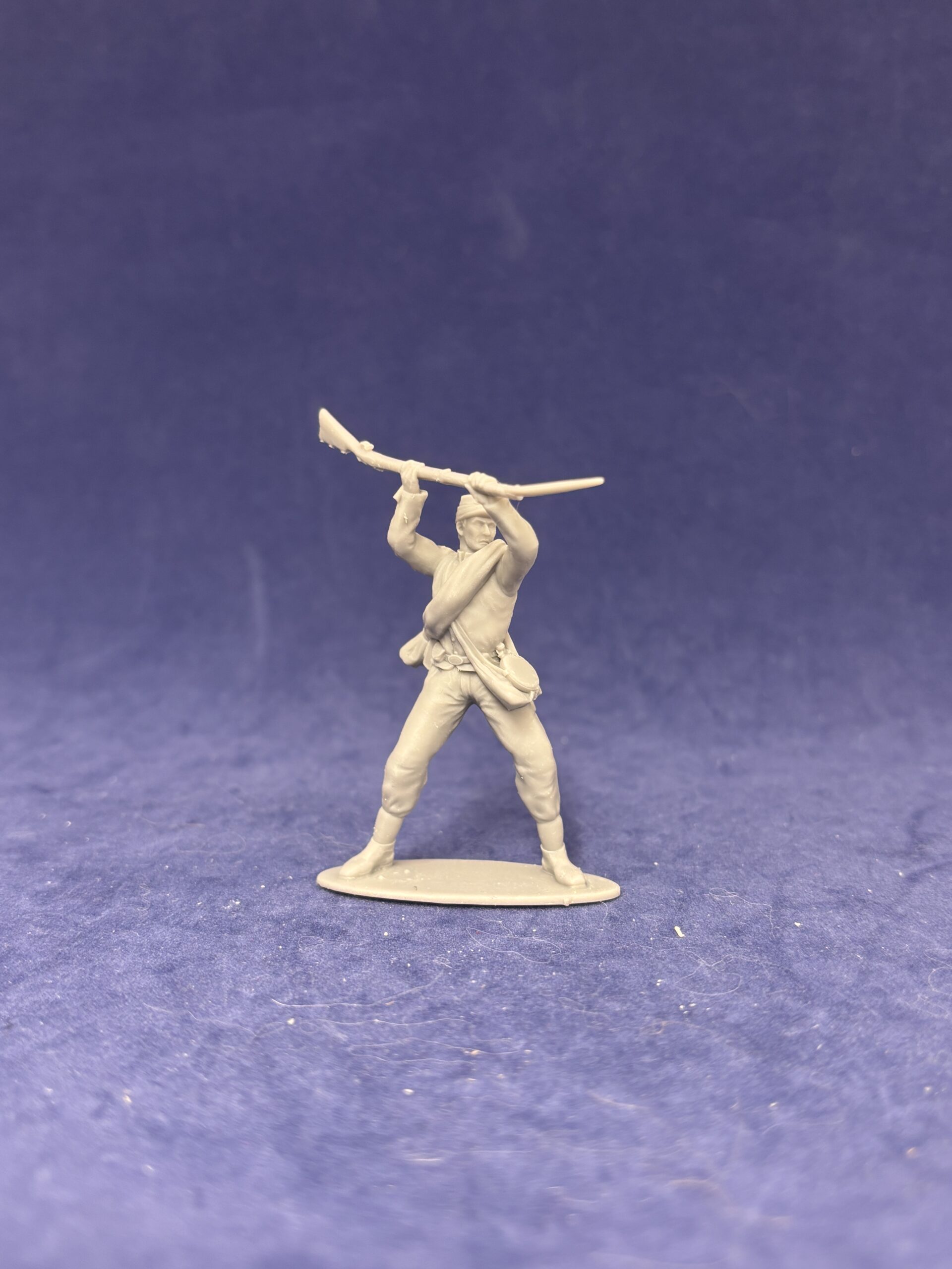 Confederate soldier in kepi attacks enemy