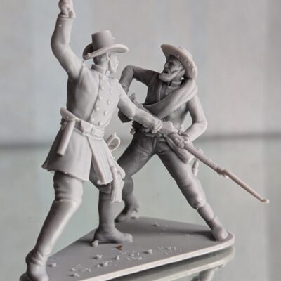 Union officer beating Confederate soldier with revolver