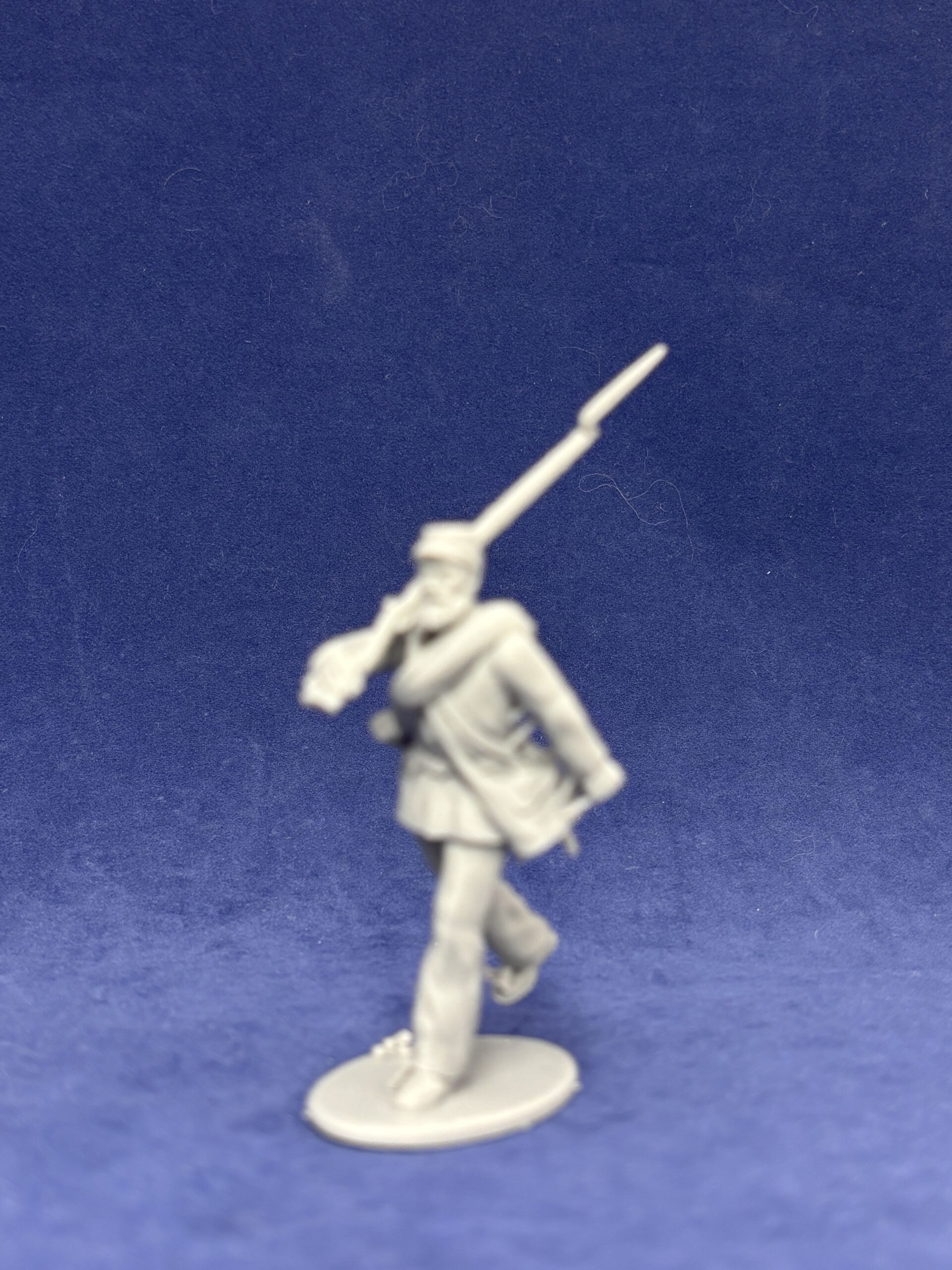 Advancing infantry in Kepi Long jacket medium beard