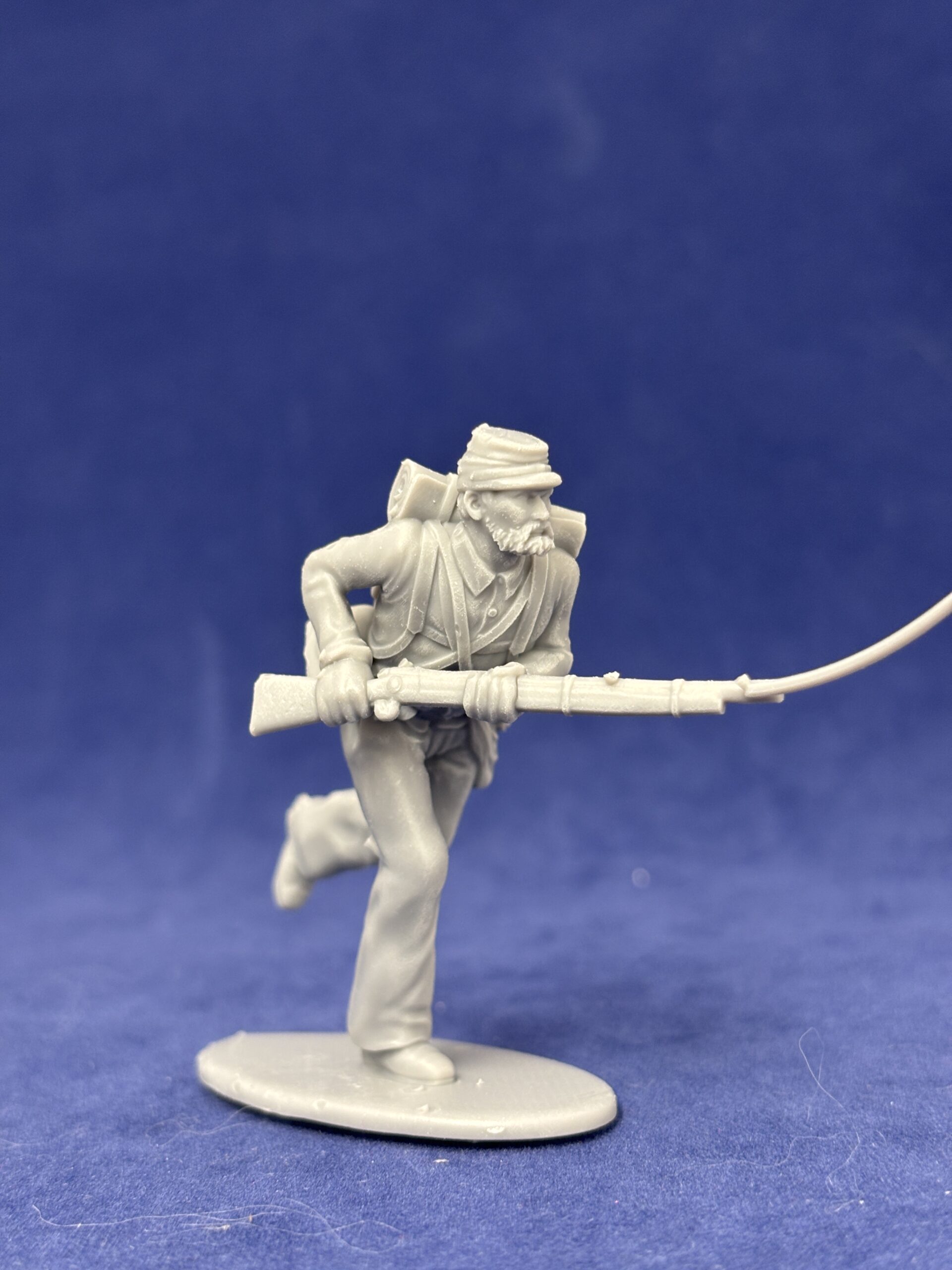 Soldier running with rifle with Kepi Scruffy Beard