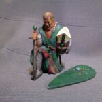 Medieval bishop kneeling and praying - NCM photo review