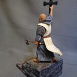Priest holding the Cross of Pelayo photo review