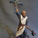 Priest holding the Cross of Pelayo photo review