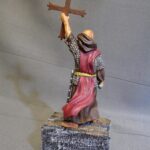 Priest holding the Cross of Pelayo photo review