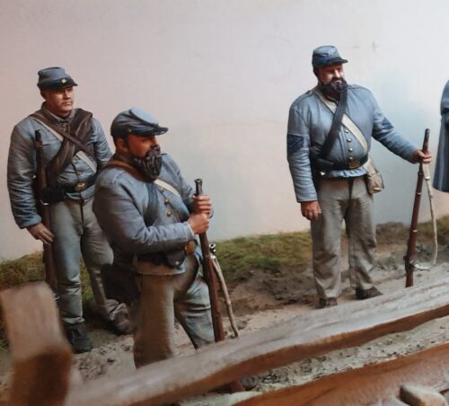 Confederate artillery standing with rifle in hand photo review