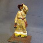 Western Lady with teapot, wind blowing photo review
