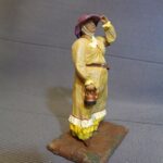 Western Lady with teapot, wind blowing photo review