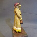 Western Lady with teapot, wind blowing photo review