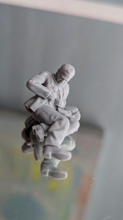 Wounded man checking injury, Union soldier