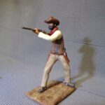 Cowboy aiming with rifle photo review