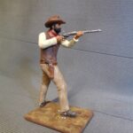 Cowboy aiming with rifle photo review