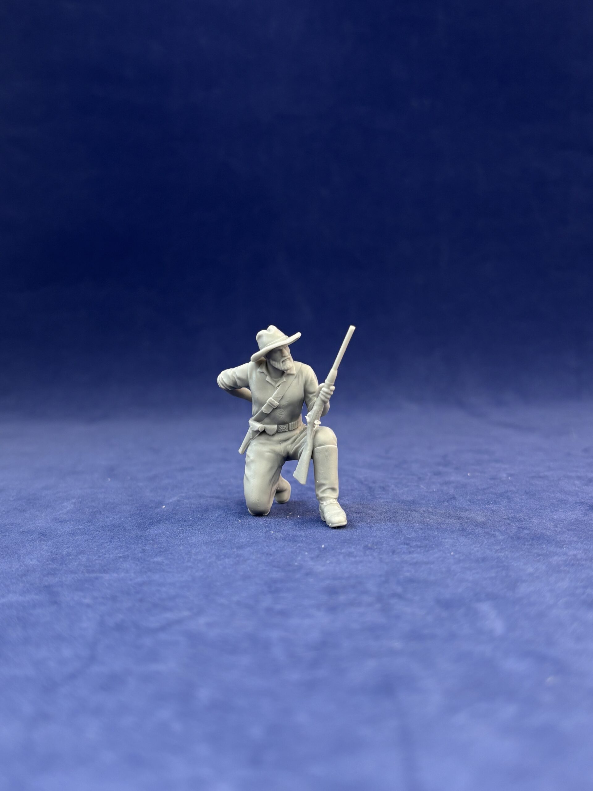 Dismounted 7th Cavalry, kneeling loading carbine