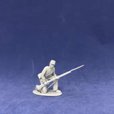 Civil war soldier kneeling, in kepi