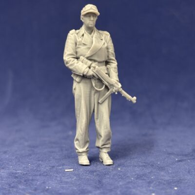 German WW2 soldier in cap standing guard with MP40