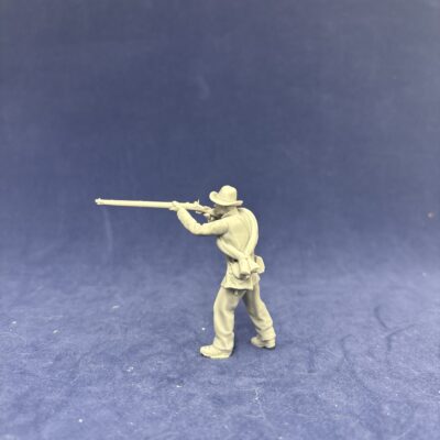 Confederate Civil War soldier firing behind wall