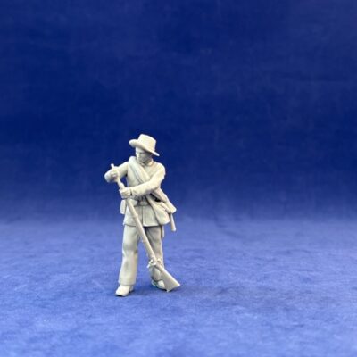 Confederate Civil War soldier loading behind wall